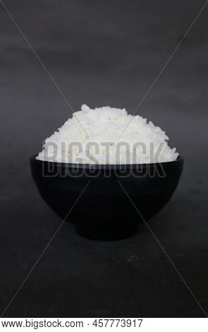 White Steamed Rice Or Nasi Putih Served In Little Bowl Isolated On White Background