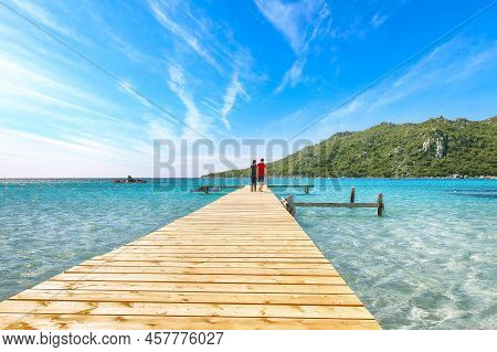 Amazing Landscape With Wooden Pier On Santa Giulia Beach.. Picturesque Seascape Of Mediterranean Sea