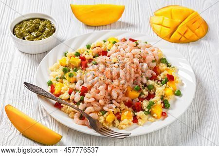 Cooked Salad Shrimps Topped On Millet Porridge With Green Peas, Mango, Red Peppers On White Plate On