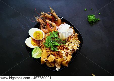 Laksa, Laksa Curry Made From Vermicelli, Noodles, Bean Sprouts, Egg, Tofu Lime, And Shrimp With A Sp