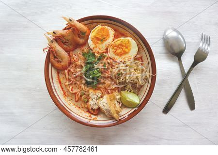 Laksa, Laksa Curry Made From Vermicelli, Noodles, Bean Sprouts, Egg, Tofu Lime, And Shrimp With A Sp