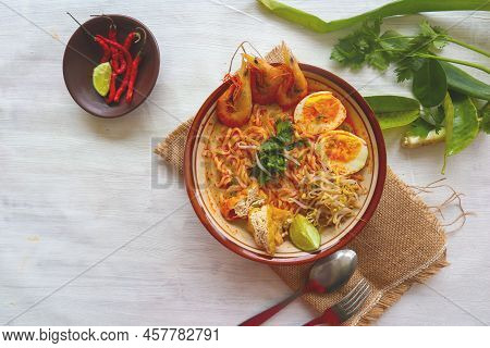 Laksa, Laksa Curry Made From Vermicelli, Noodles, Bean Sprouts, Egg, Tofu Lime, And Shrimp With A Sp