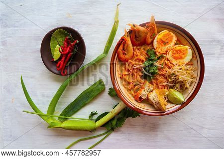 Laksa, Laksa Curry Made From Vermicelli, Noodles, Bean Sprouts, Egg, Tofu Lime, And Shrimp With A Sp