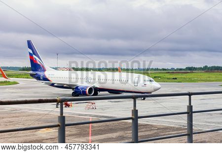 Airplane Parked In Airport Waiting For Boarding Passengers. July 03, 2022 Tomsk Russia Transport And