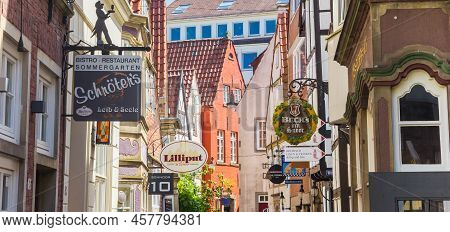 Bremen, Germany - May 18, 2022: Panorama Of Many Signs In The Narow Street Of Schnoor Neighbourhood 