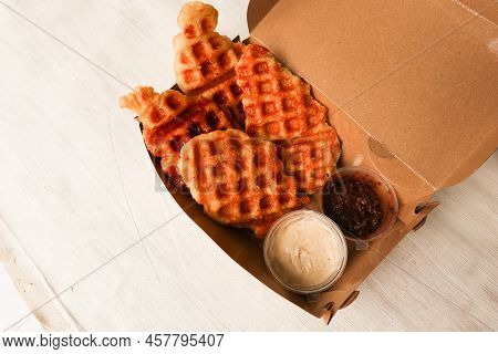 Croissant Waffle Or Croffle With Chocolate Sauce Served In Box And White Background