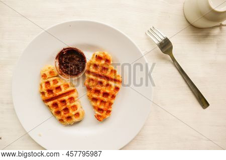 Croissant Waffle Or Croffle With Chocolate Sauce Served In Box And White Background