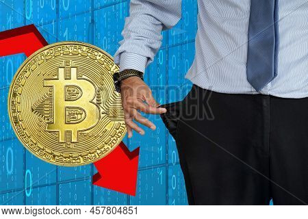 Hand Of Man In Suit Turning Pocket Of His Trousers Inside Out And Showing It Empty On Bitcoin Backgr