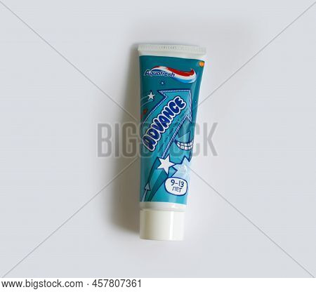 July 7, 2022 Ukraine City Kyiv Children\'s Toothpaste From The Aquafresh Company On A Colored Backgr