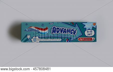 July 7, 2022 Ukraine City Kyiv Children\'s Toothpaste From The Aquafresh Company On A Colored Backgr