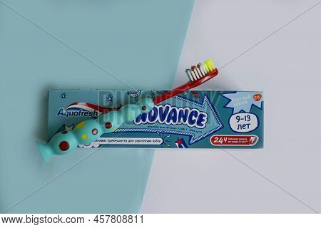 July 7, 2022 Ukraine City Kyiv Children\'s Toothpaste From The Aquafresh Company On A Colored Backgr