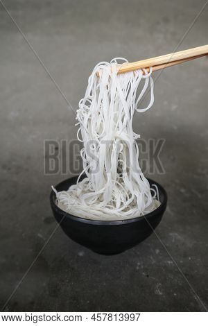 Bihun Or Vermicelli Or Rice Noodles Or Angel Hair Isolated On Black Background. Served On Small Bowl