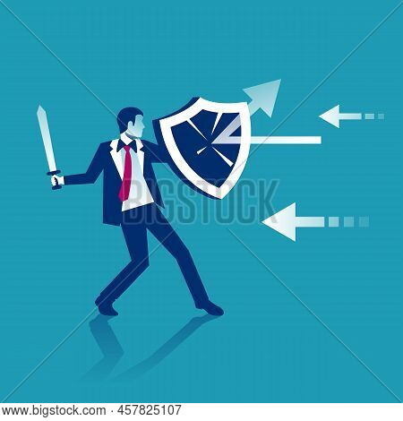 Attack Protection. Businessman Holds A Shield Defending From Attacks.