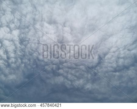 Nature, In Front Of A Stormy Sky Cloud, Stratus Cumulus Rain Clouds. Anxious Mood. For Background