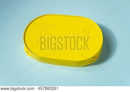 Tyumen, Russia-may 11, 2022: Nestle Nesquik Cocoa Logo. Blue Background. Selective Focus