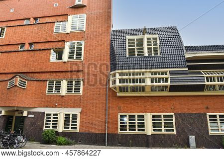 Amsterdam, Netherlands. June 2022. View Of Characteristic Brick Residential Building In The Style Of