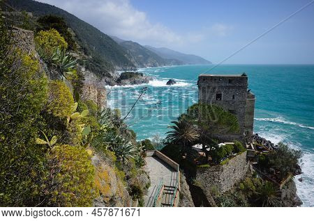 View Of Old Stone Fortress On Cliff On Mediterranean Sea Cinque Terre,  Riomaggiore, Liguria, Italy.