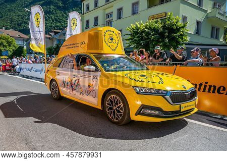 Aigle, Valais Canton, Switzerland -10.07.2022: Passage Of An Advertising Car Of Yellow Jersey Lcl In