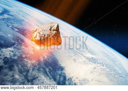 Planet Earth And Big Asteroid In The Space. Potentially Hazardous Asteroids. Asteroid In Outer Space