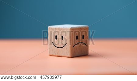 Mental Health And Emotional State Concept, Smile Face In Bright Side And Sad Face In Dark Side On Wo