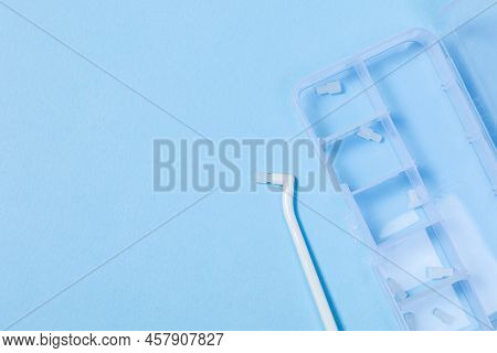 Orthodontic Toothbrush With One Bundle For Braces On A Blue Background Special Tool For Oral Care