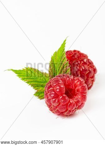 Ripe Raspberries With Leaves Isolated On White Background