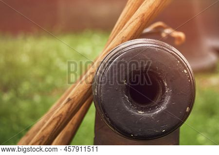Vintage Swedish Cannons And Metal Cannonballs. Ancient Military Arsenal Of The Events Of The Russian