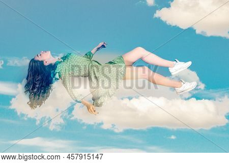 Floating In Air. Relaxed Girl In Vintage Ruffle Dress Levitating Keeping Eyes Closed, Sleeping While