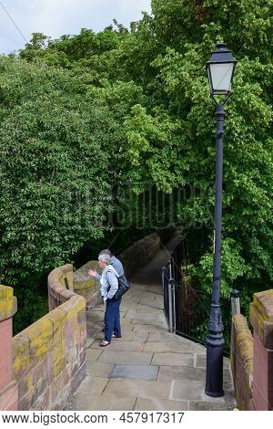 Chester, Uk: Jul 3, 2022: Chester, Uk: Jul 3, 2022: Tourists Enjoy A Walk Along The Chester City Wal