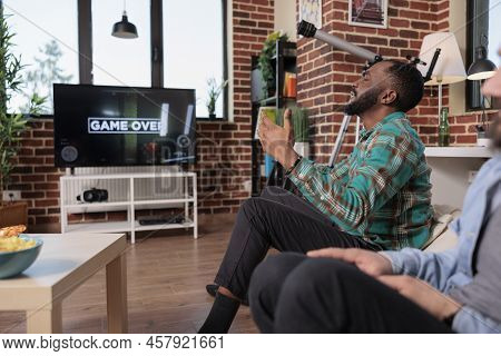 Sad African American Person Playing Video Games And Losing, Feeling Angry And Frustrated About Lost 