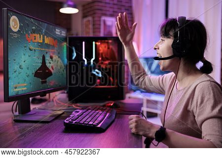 Cheerful Woman Celebrating Video Games Championship Win On Online Live Stream, Feeling Happy At Desk