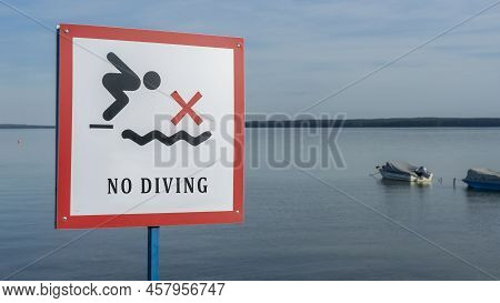 No Diving Sign At Beach, Lake Naroch, Belarus. Warning Sign Of Shallow Water. Warning Notice Sign Do