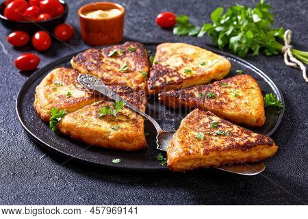 Close-up Of Potato Farls, Irish Potato Cakes, Potato Bread On Black Plate On Concrete Table With Mus