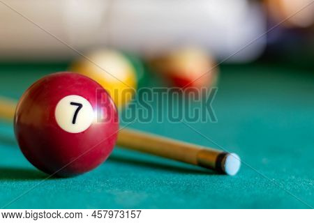 Billiard Seven Ball On Green Tapestry And More Balls In The Backgrownd