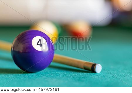 Billiard Four Ball On Green Tapestry And More Balls In The Backgrownd