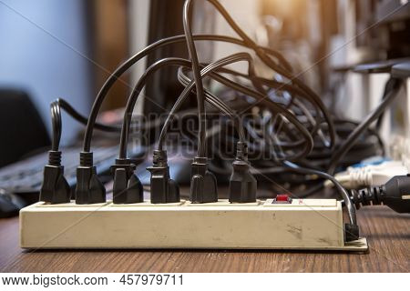 Old And Damaged Electric Adapter Power Plug Has Many Appliances Are Plugged Outlet Socket Concept Of