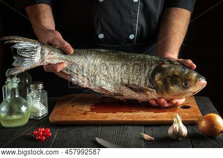 Chef Prepares Silver Carp Fish. Preparing For The Preparation Of Fish Food For The Holidays. Working