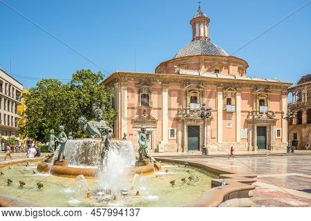 Valencia,spain - May 28,2022 - View At The Fountain Of Turia And Basilica Of Our Lady At Virgin Squa