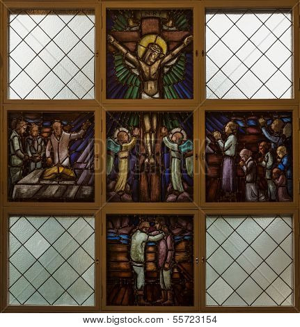Stained Glass Window Picturing Jesus On The Cross.
