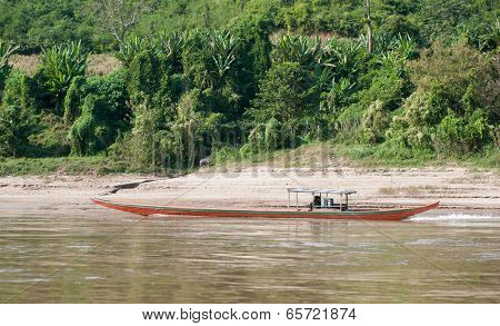 Mekong River Cruise in Laos. Popular tourist adventure trip by slow boat from Huay Xai to Luang Prabang.