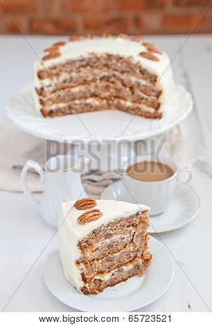 A Piece Of Hummingbird Cake With Pecans And Cream Cheese Frosting