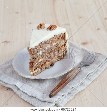 A Single Piece Of Hummingbird Cake With Pecans And Cream Cheese Frosting
