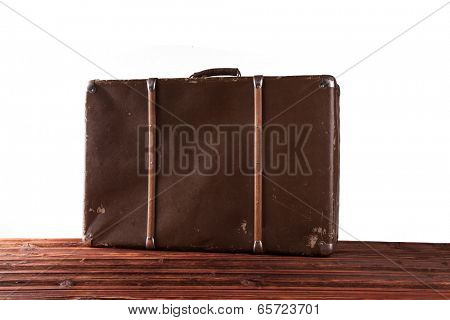 Concept of summer travelling with old suitcase. Isolated on white background