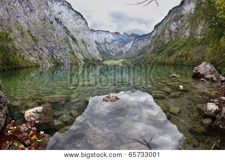 Cloudy sky reflected in lake.  Fabulously beautiful lake Koenigssee