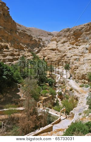 The bridge on a mountain road going to the temple - the Monastery of St. George the Victorious. Wadi Kelt near Jerusalem.