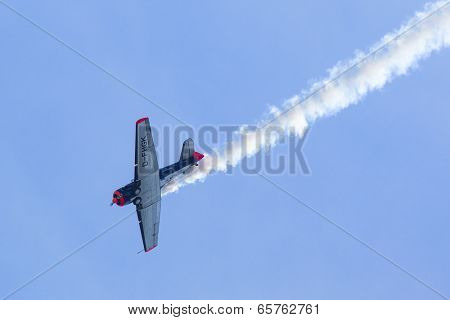 BERLIN, GERMANY - MAY 20, 2014: The aircraft Red Bull Noorduyn AT-16 D-FHGK demonstration during the International Aerospace Exhibition ILA Berlin Air Show-2014.