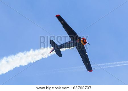 BERLIN, GERMANY - MAY 20, 2014: The aircraft Red Bull Noorduyn AT-16 D-FHGK demonstration during the International Aerospace Exhibition ILA Berlin Air Show-2014.