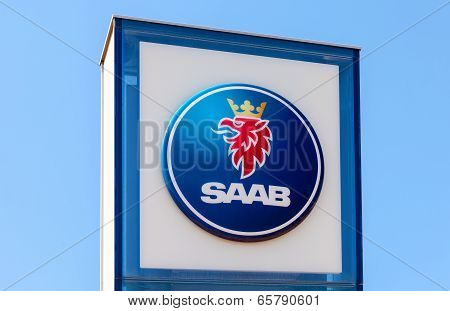 Samara, Russia - May 24, 2014: The Emblem Saab Over Blue Sky. Saab Automobile Ab Is A Swedish Premiu