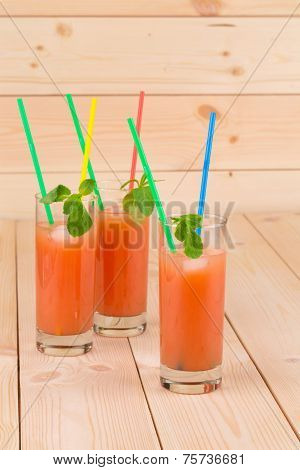 Grapefruit juice on table.