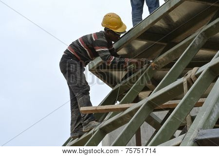 Construction welder welding metal